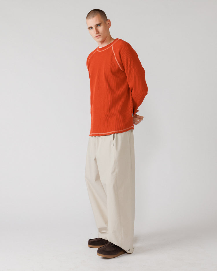 Raglan Range Waffle Knit - Signal Red w Ecru — side profile, sleeve shape