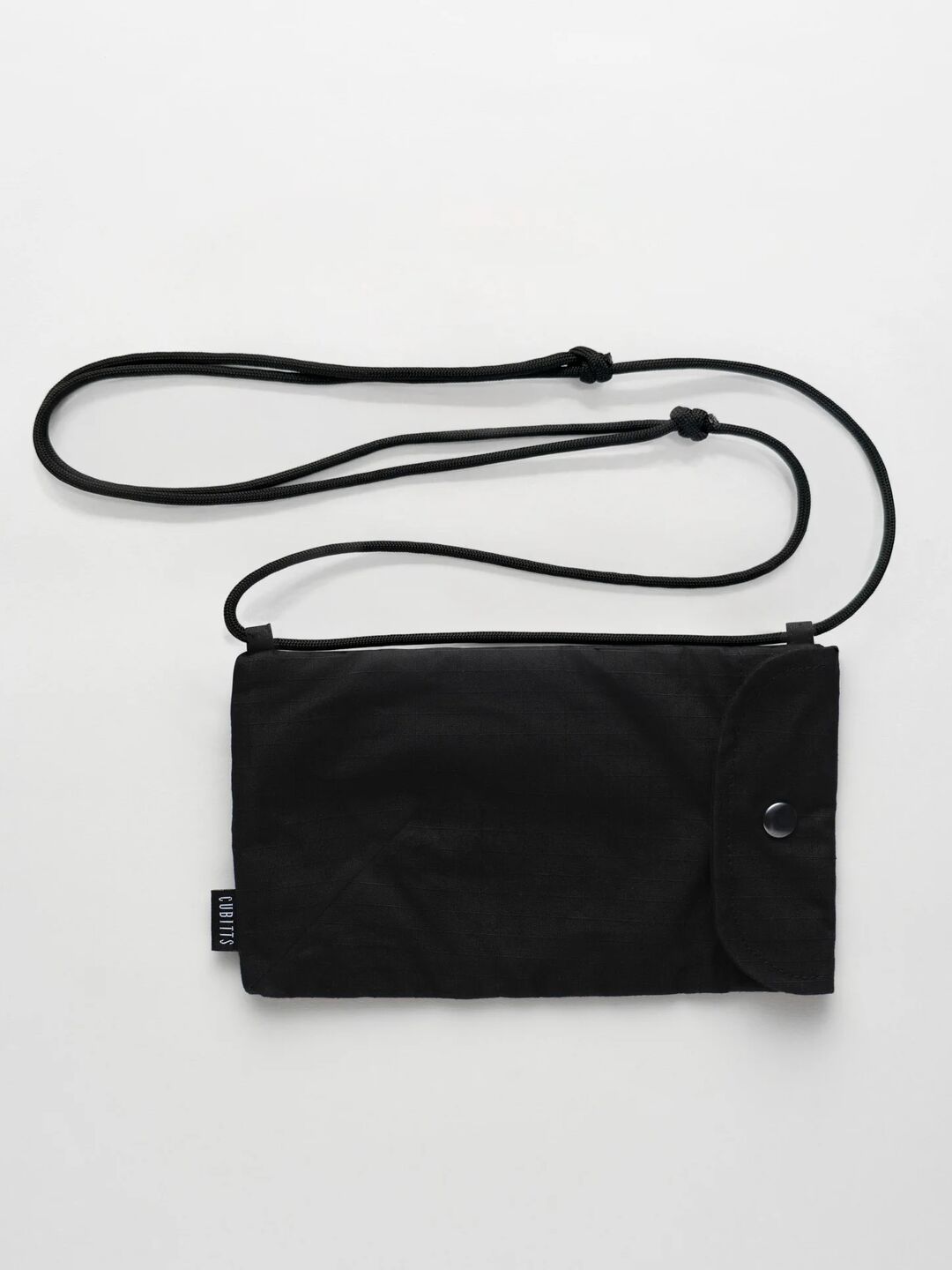 WAWWA x Cubitts Sunnies Sling in black with adjustable cord strap, front view