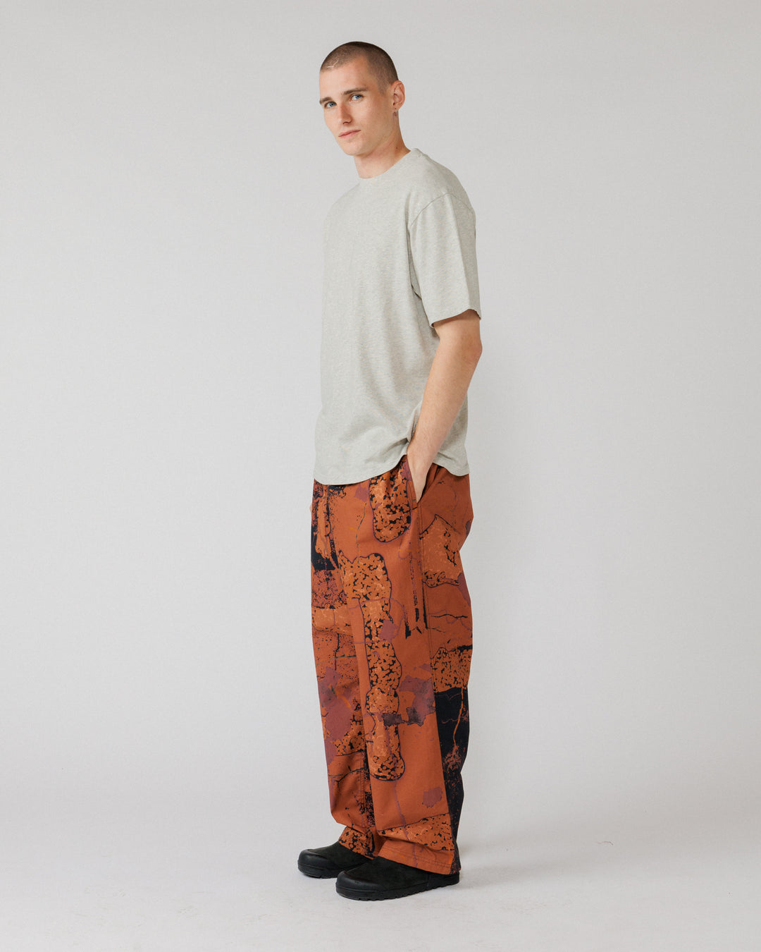 Water Resistant Zama Pants - Abstract Brick Camo — 3/4 angle, drape and pocket